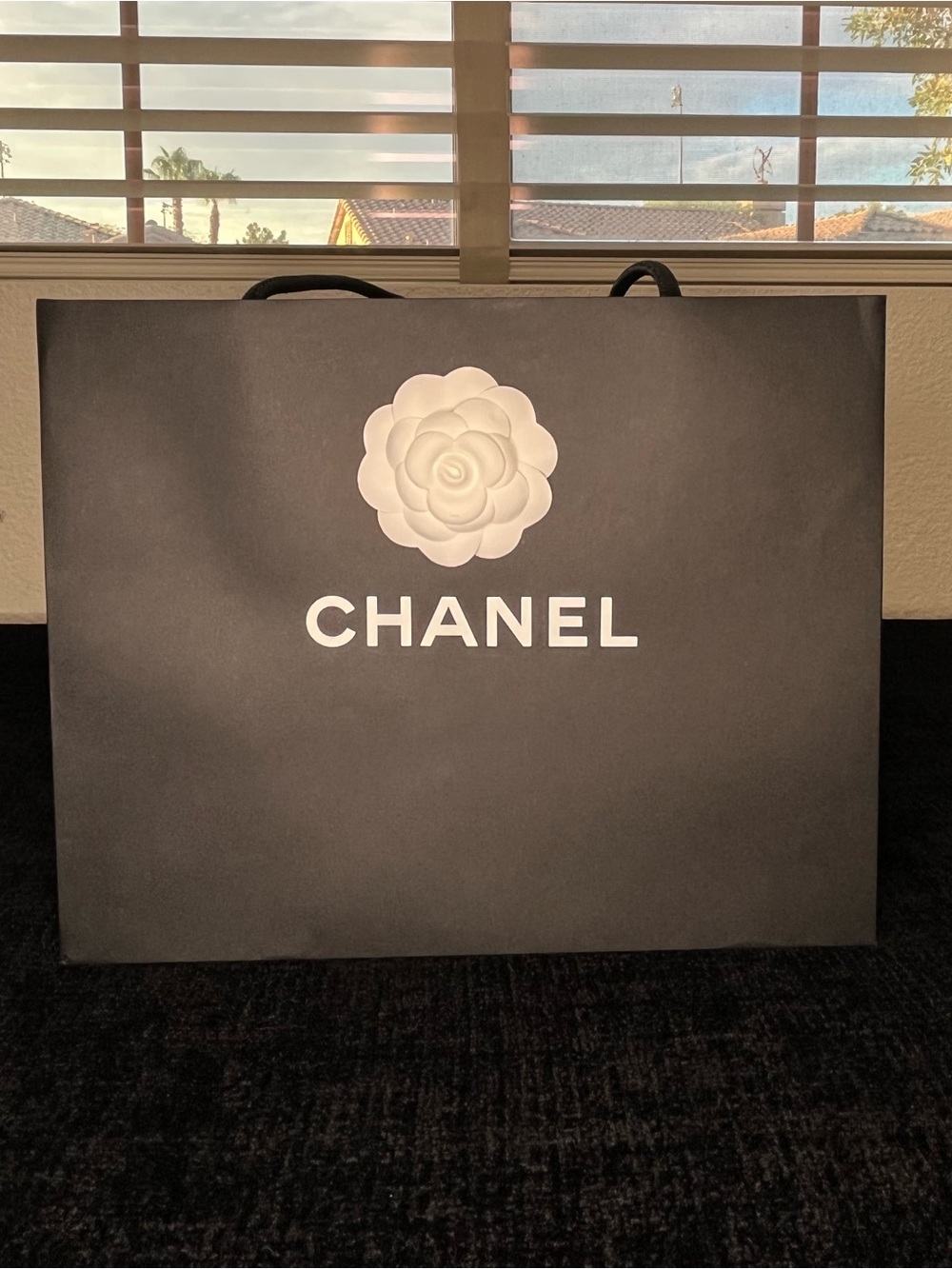 Authentic CHANEL Black Shopping Bag with White Camellia Logo